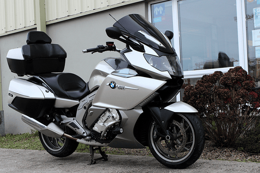 Silver motorcycle with building background