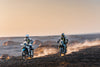 Two CFMOTO 450MT in Tundra Grey and Zephyr Blue riding side by side in desert environment.