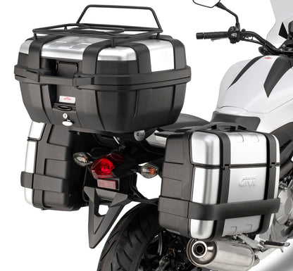 Motorcycle with black and silver luggage boxes on a white background