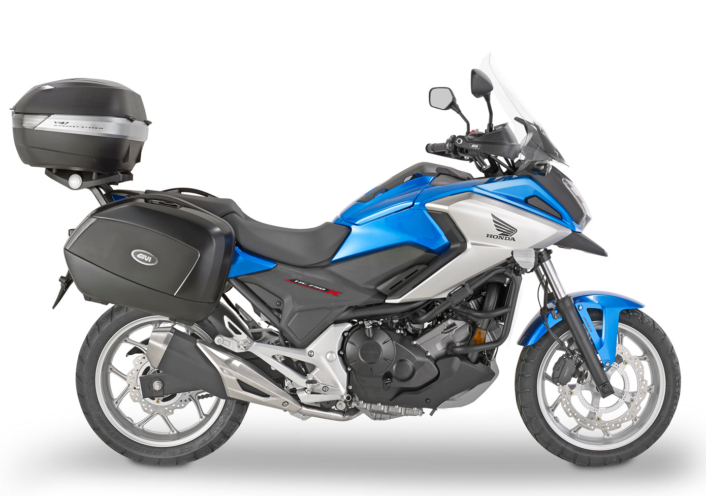 Blue and black motorcycle with a top box on a white background