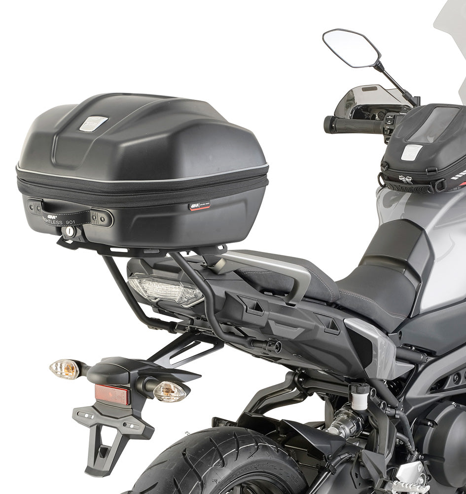 Motorcycle with a top box and rearview mirror on a white background