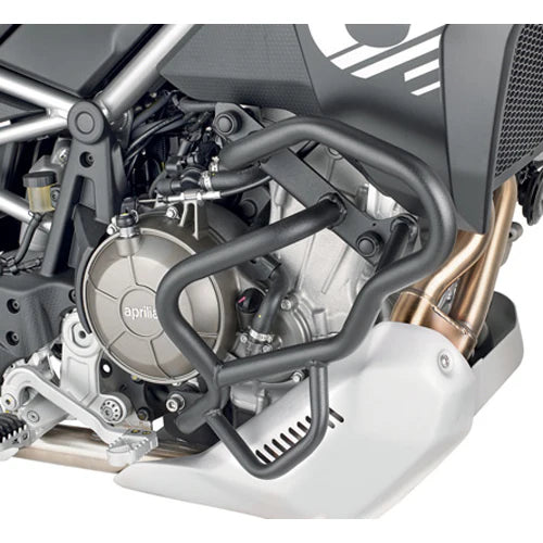 Close-up of a motorcycle engine with protective guard, brand 'Aprilia' visible.