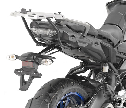 Close-up of a motorcycle with a luggage rack on a white background